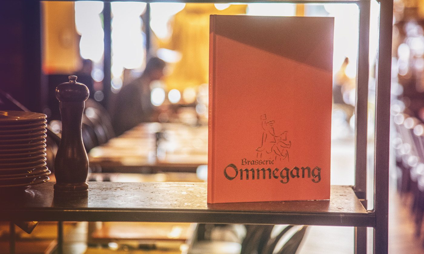Carte de la Brasserie Ommegang posée sur une table de la brasserie